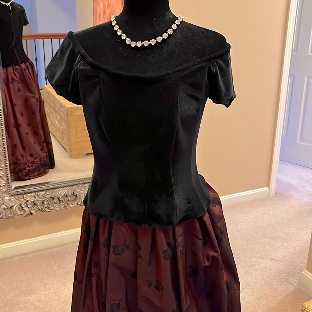 Black Velveteen off the shoulder top with zipper back and cap sleeve.